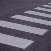 Close-up of a painted crosswalk on asphalt