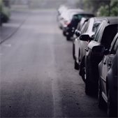 Cars parked along a residential street.