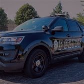 close up photo of black lombard police squad car