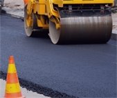 close up photo of paving asphalt road machine