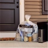 Bag of household hazardous waste materials and an old computer placed outside a home for special collection