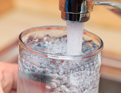 water from the tap filling glass