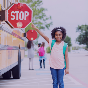 mom high fiving daughter before school