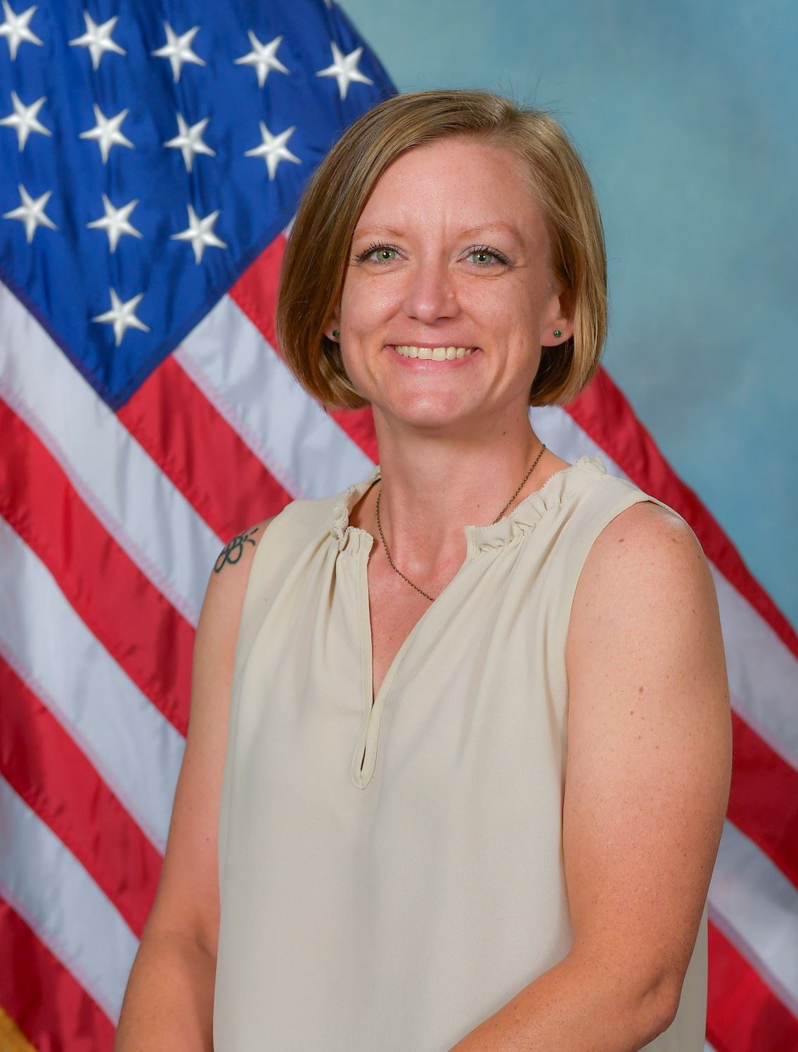 Headshot of Trustee Jessie Hammersmith with US flag in background